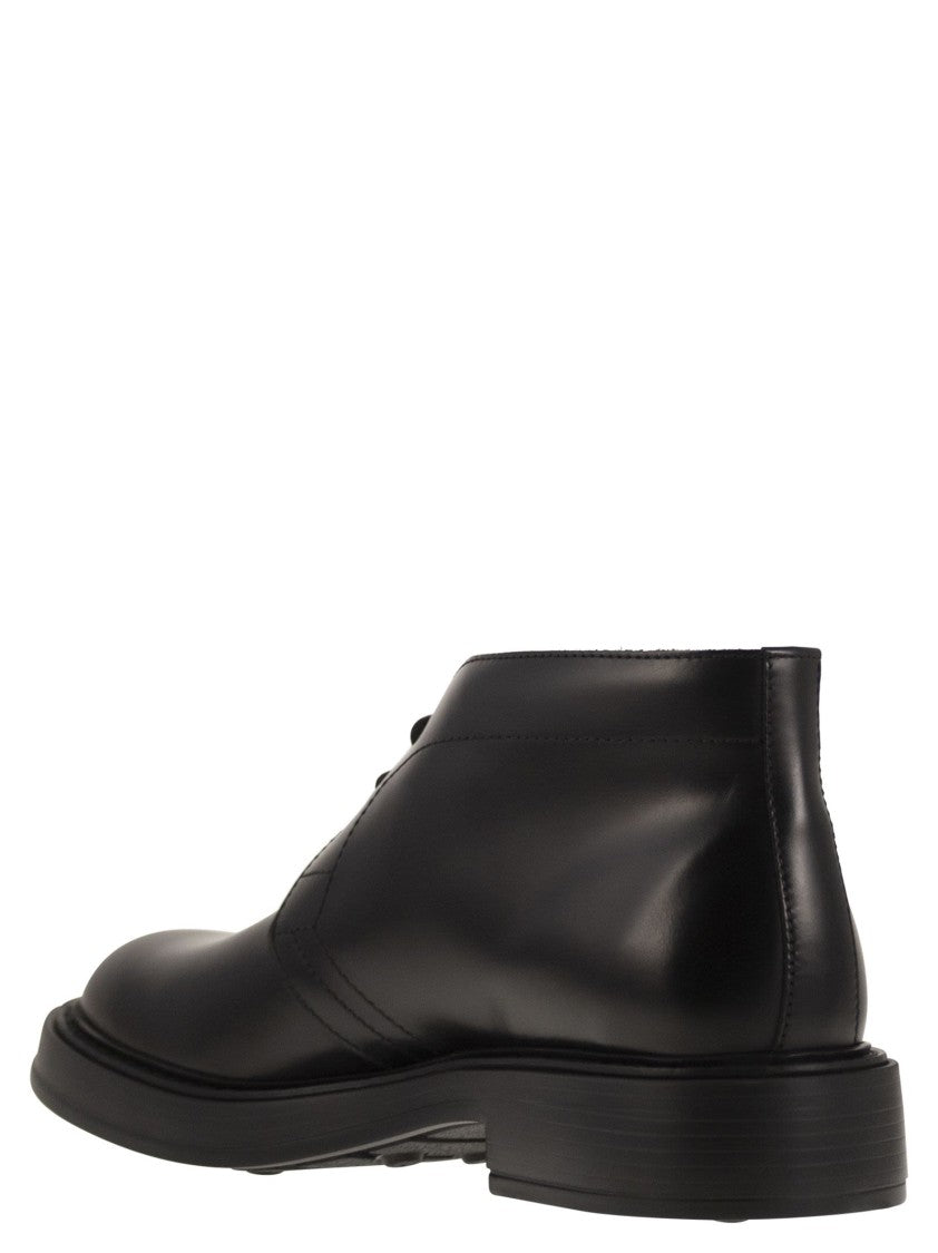 Tod's Calfskin Ankle Boots With Embossed Monogram