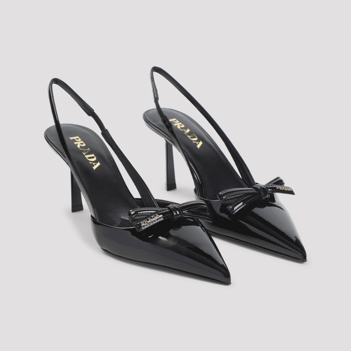 Prada Slingback Pumps With Decorative Bow And Glossy Finish