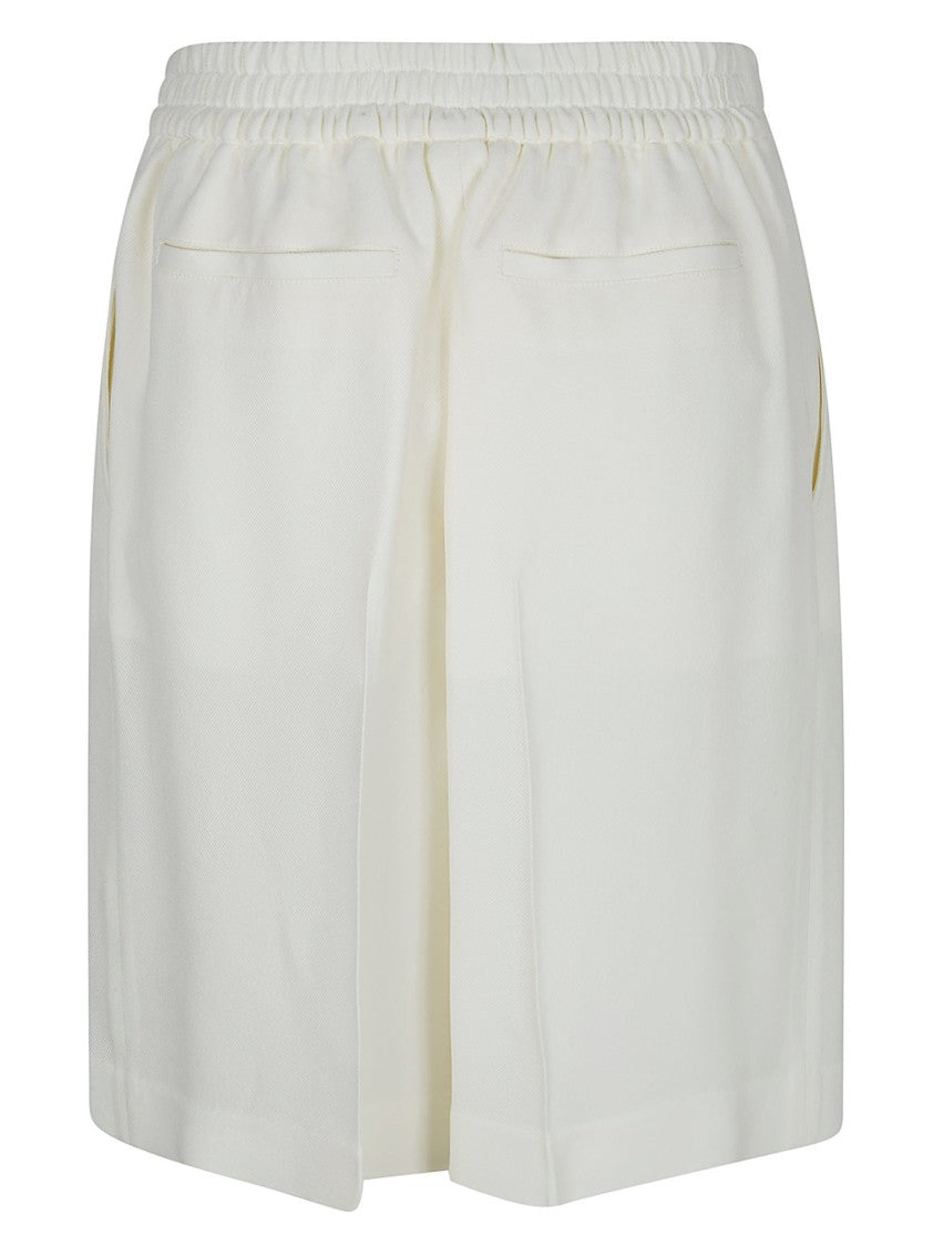 Victoria Beckham Knee-Length Tailored Shorts With Pleated Legs And Structured Silhouette