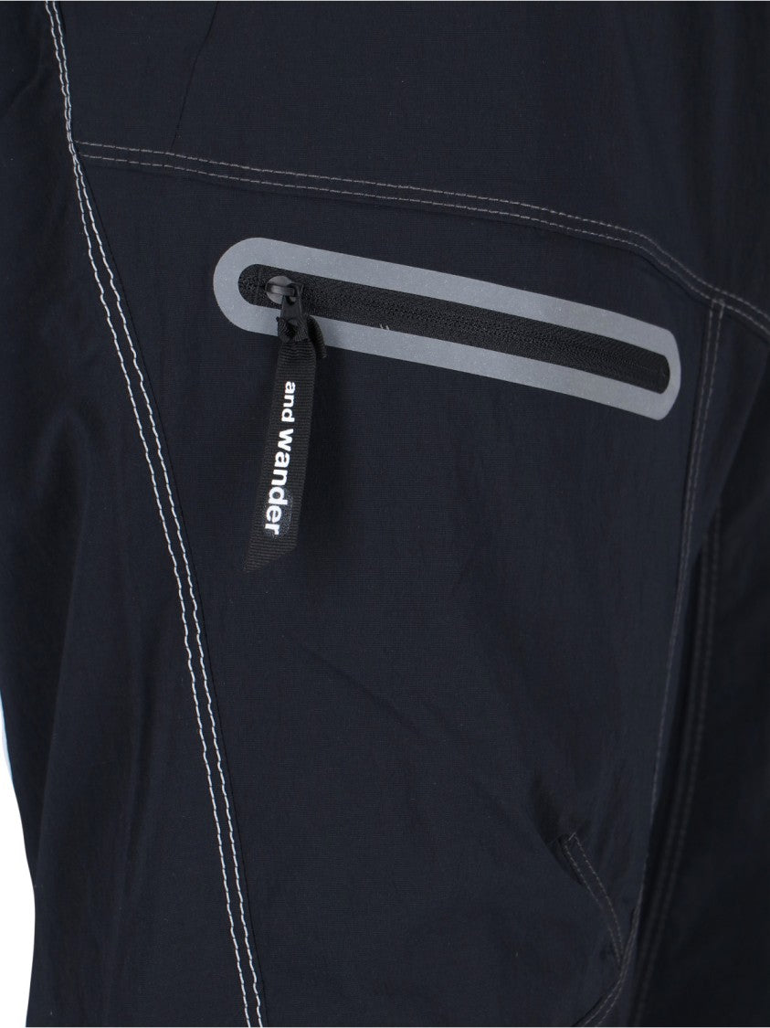 And Wander Streamlined Black Trousers With Zippered Pockets