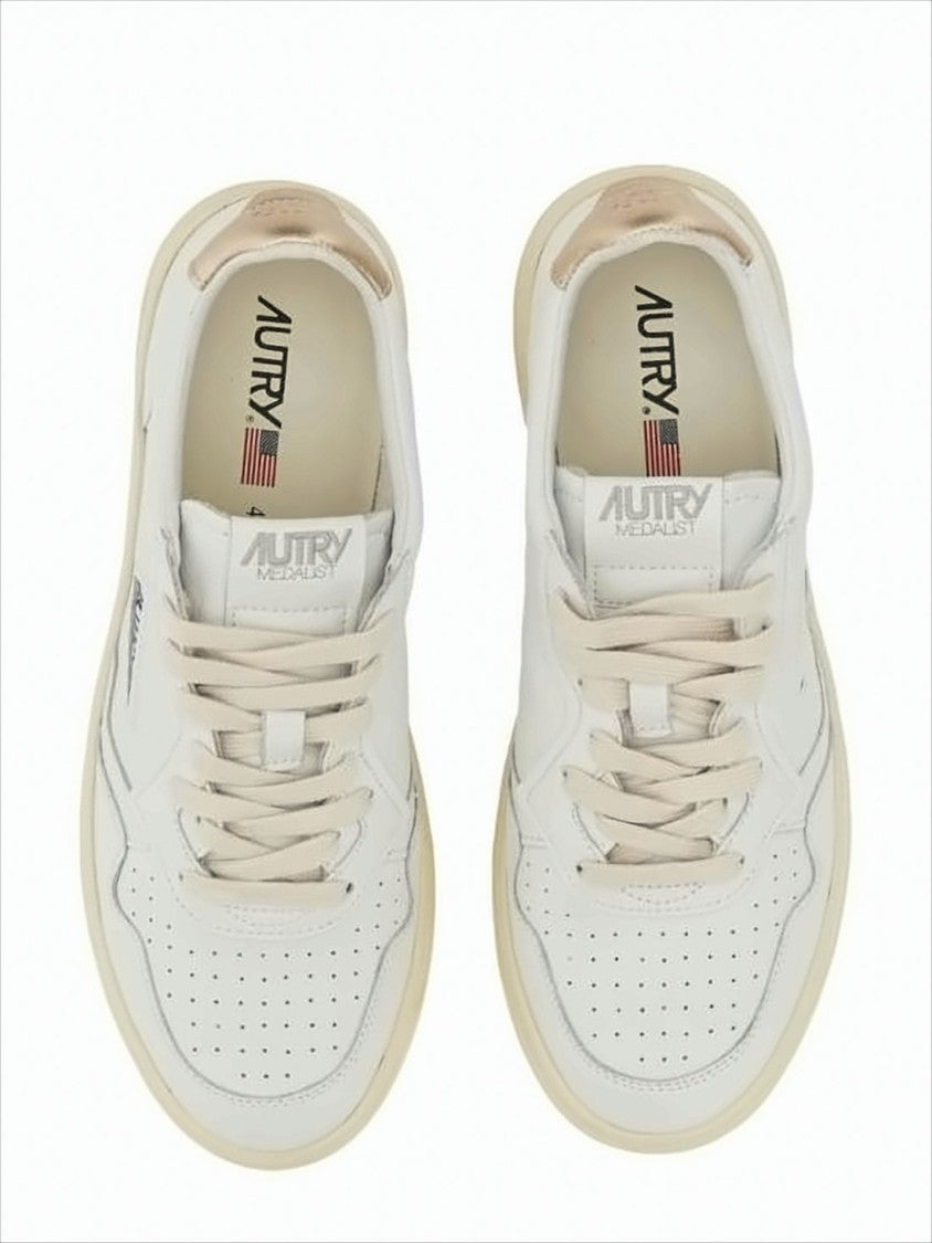 Autry Low-Top White Sneakers With Perforated Detailing And Metallic Accents