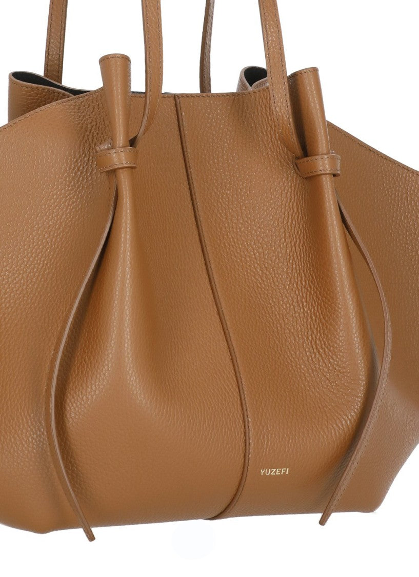 Yuzefi Winged Pebbled Leather Tote With Golden Logo