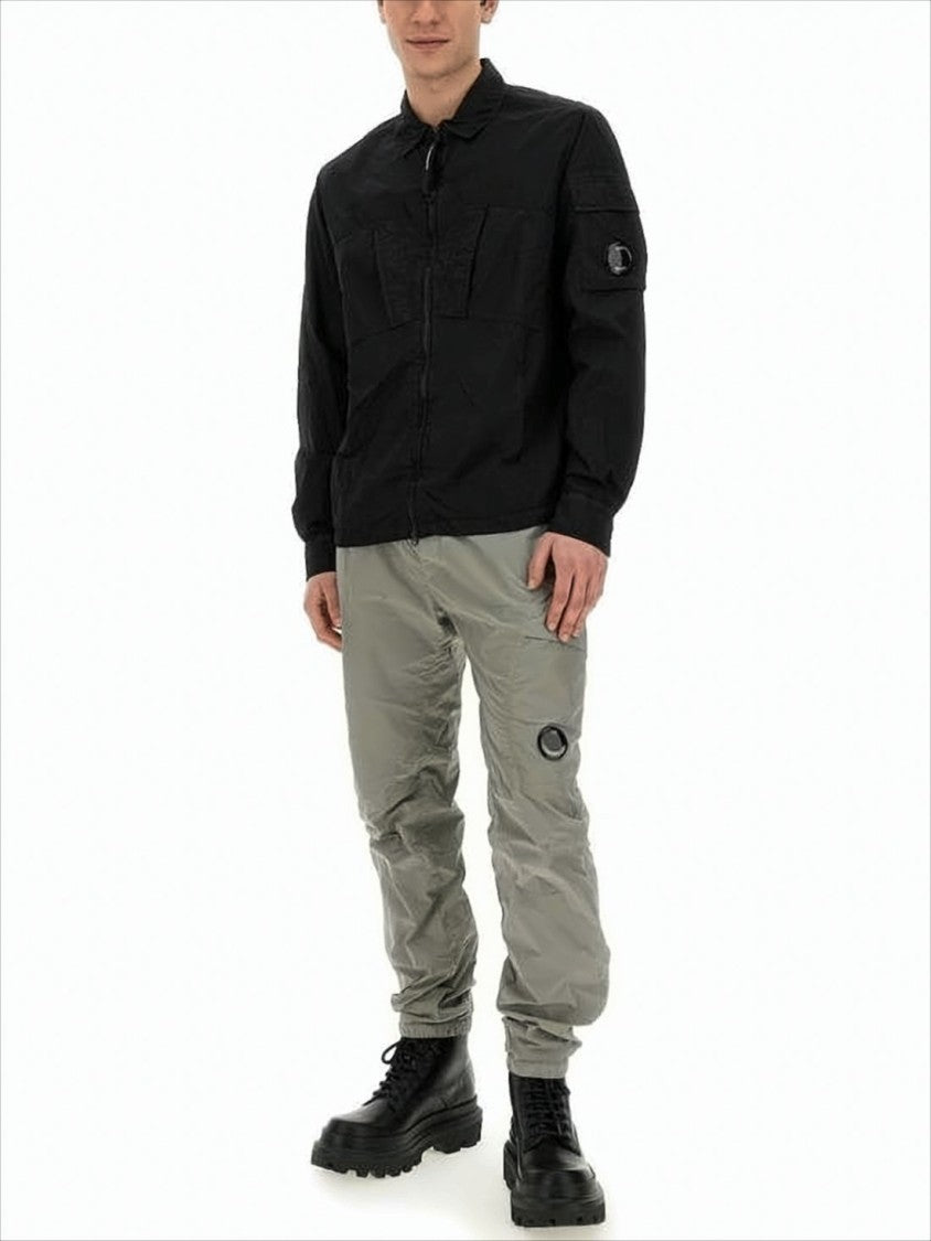 C.P. Company Minimalist Black Polyamide Jacket With Innovative Design Elements