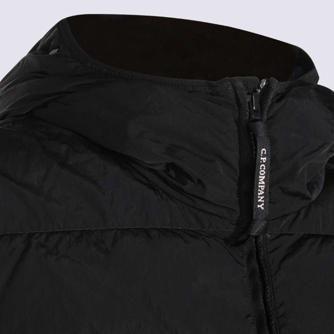 C.P. Company Minimalist Black Puffer Jacket With High Collar And Attached Hood