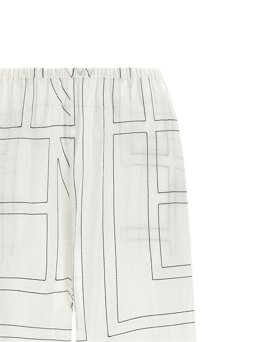 Totême Wide Leg Pajama-Style Pants With Monogram Embroidery