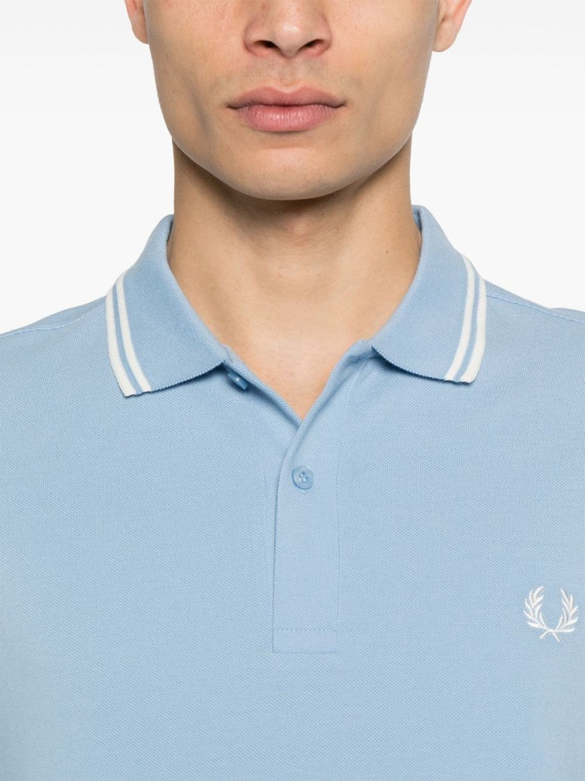 Comme Des Garçons Light Blue Polo With Striped Trim And Button Closure