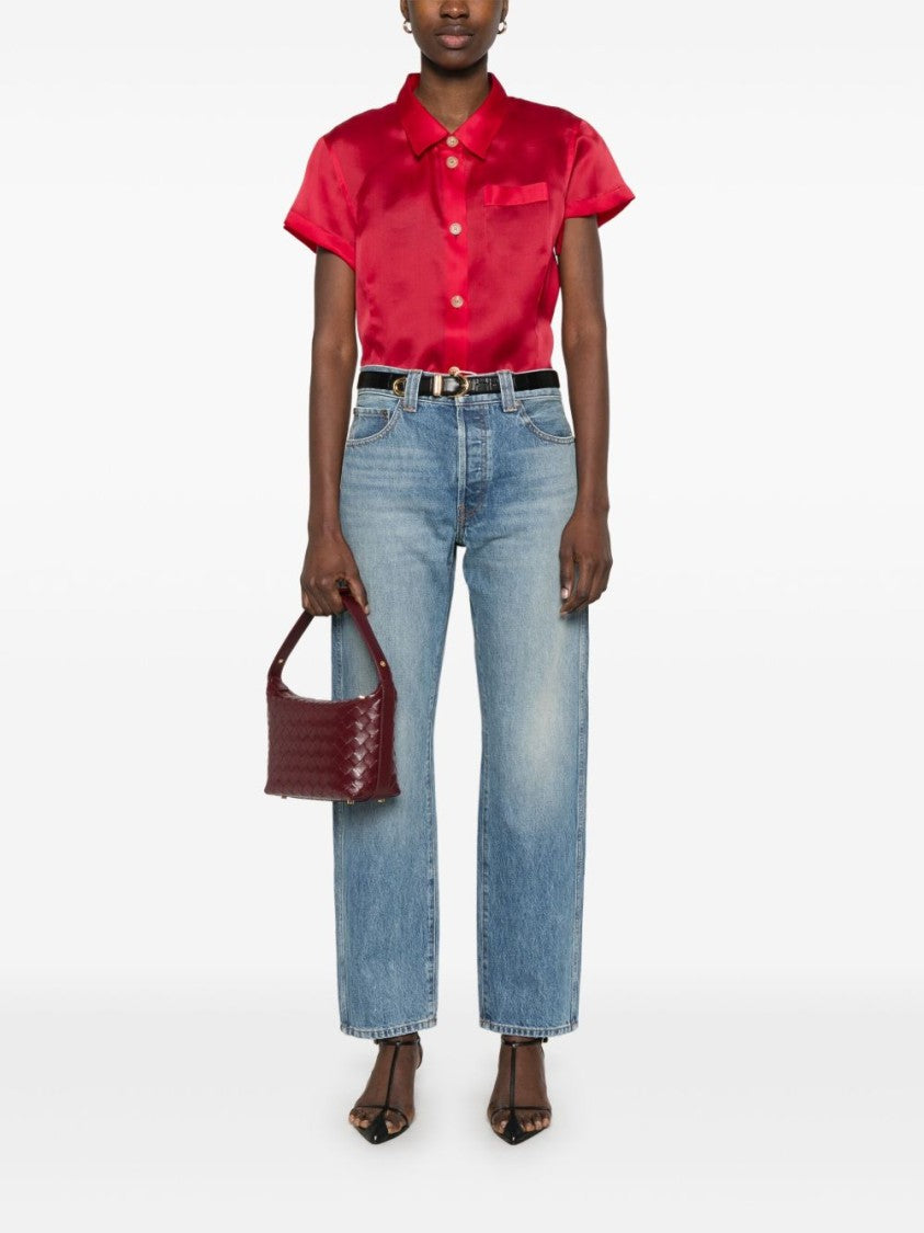 Khaite Relaxed Bow Leg Jeans In Faded Denim