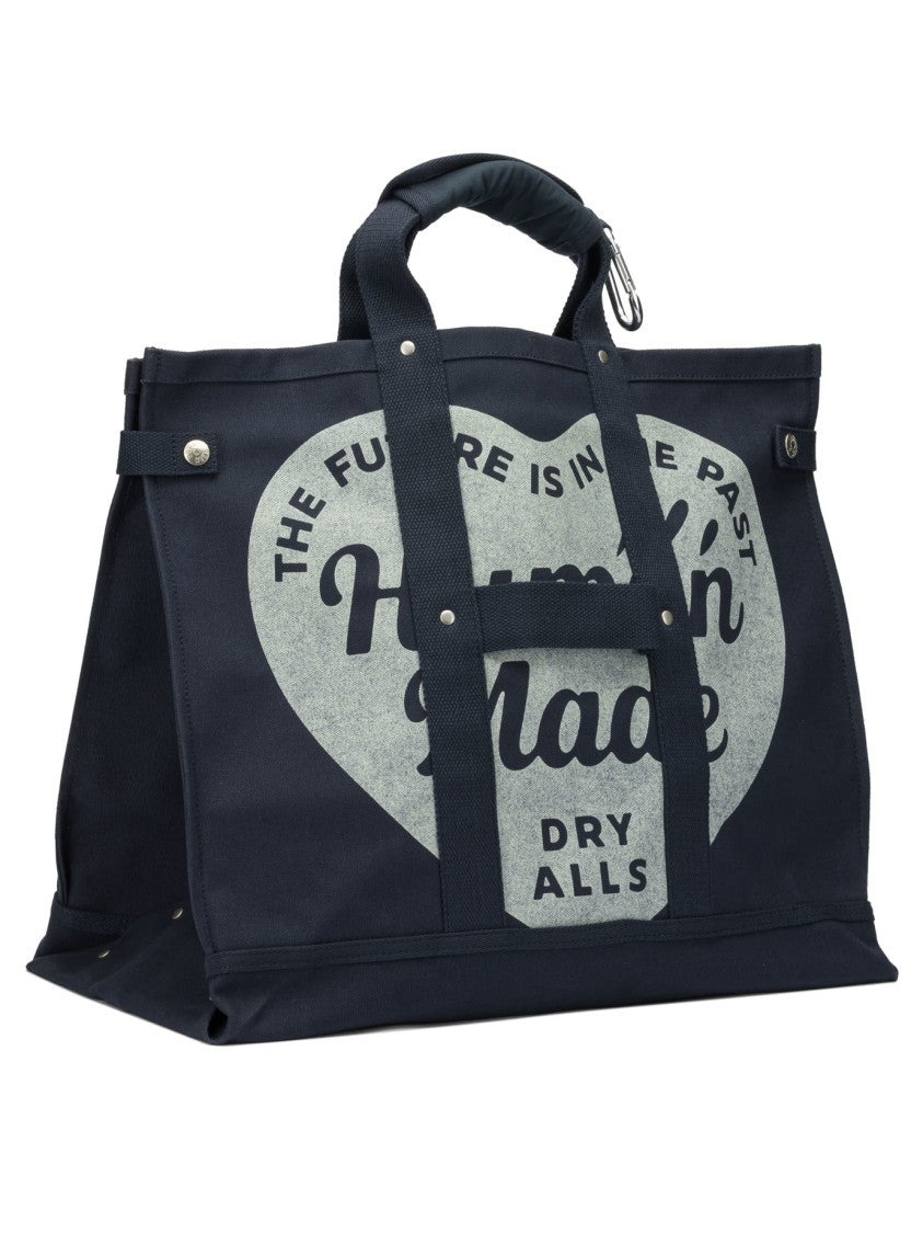 Human Made Durable Canvas Travel Bag With Heart Motif And Integrated Pocket