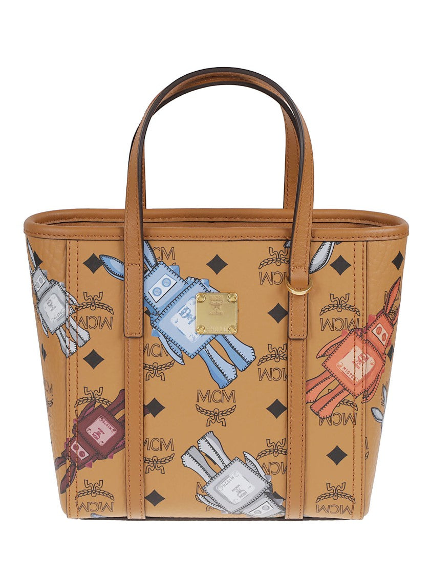 Mcm Coated Canvas Handbag With Playful Logo Print And Leather Accents