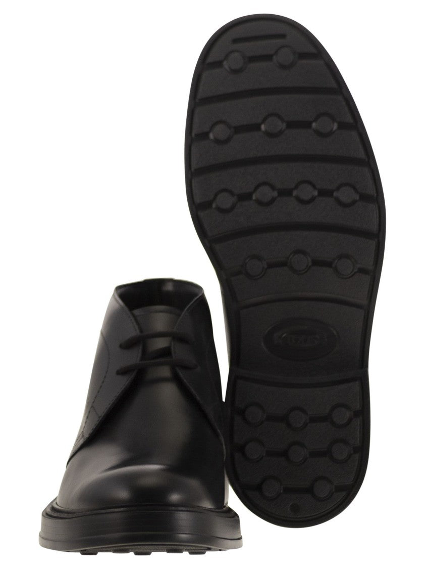 Tod's Calfskin Ankle Boots With Embossed Monogram