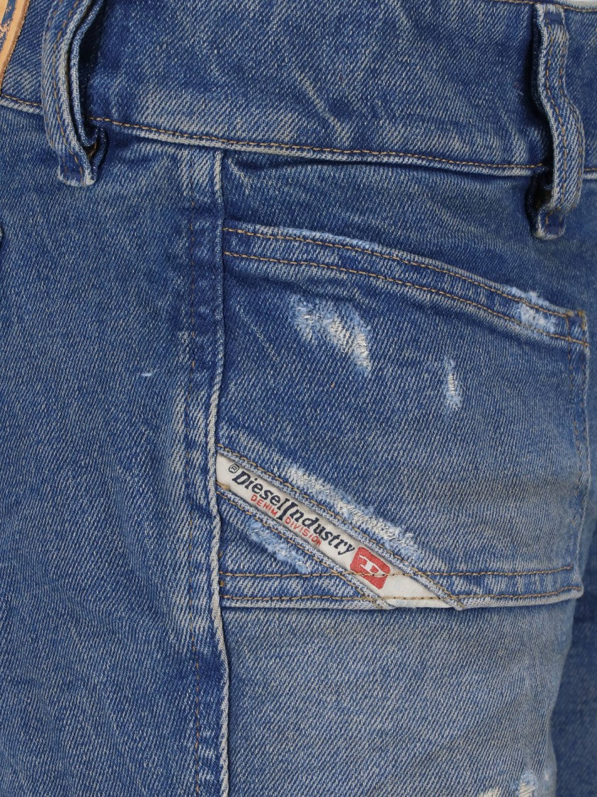 Diesel Flared Blue Wash Jeans With Vintage Distressing