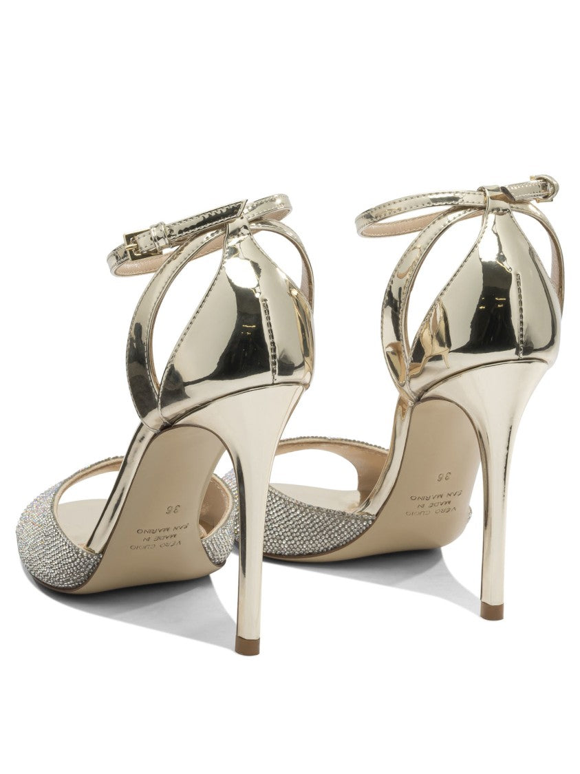 Ninalilou Gleaming Metallic Heeled Pumps With Rhinestone Strap