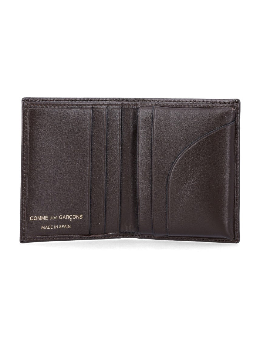 Comme Des Garçons Sleek Leather Bi-Fold Wallet With Gold Logo Accent
