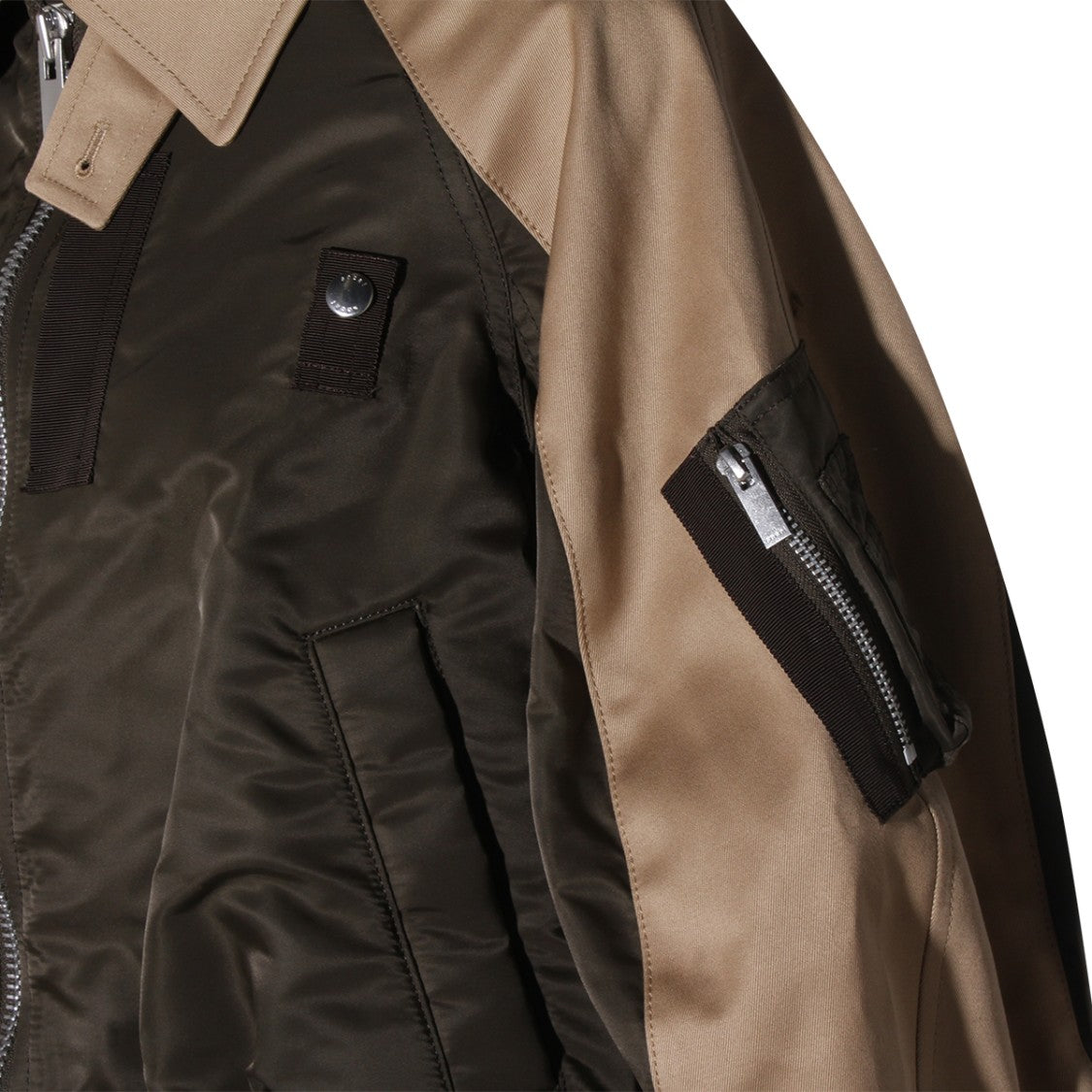 Sacai Layered Neutrals Jacket With Innovative Design And Structured Silhouette