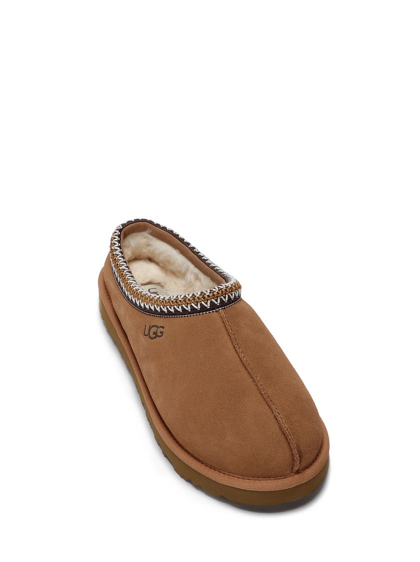 Ugg Ankle Boot With Plush Lining And Decorative Accents