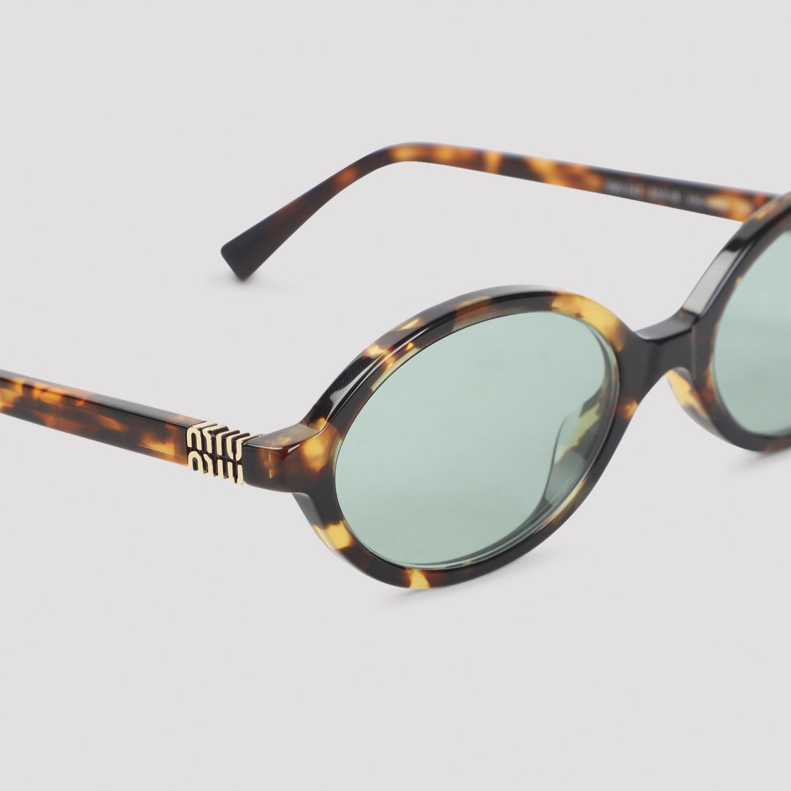 Miu Miu Tortoiseshell Round Sunglasses With Subtle Gold Accents