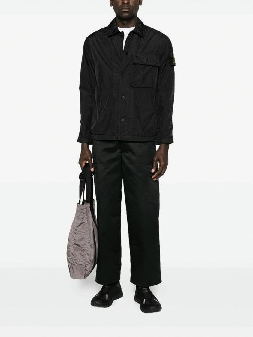 Stone Island Black Minimalist Technical Jacket With Flap Pocket And Iconic Patch