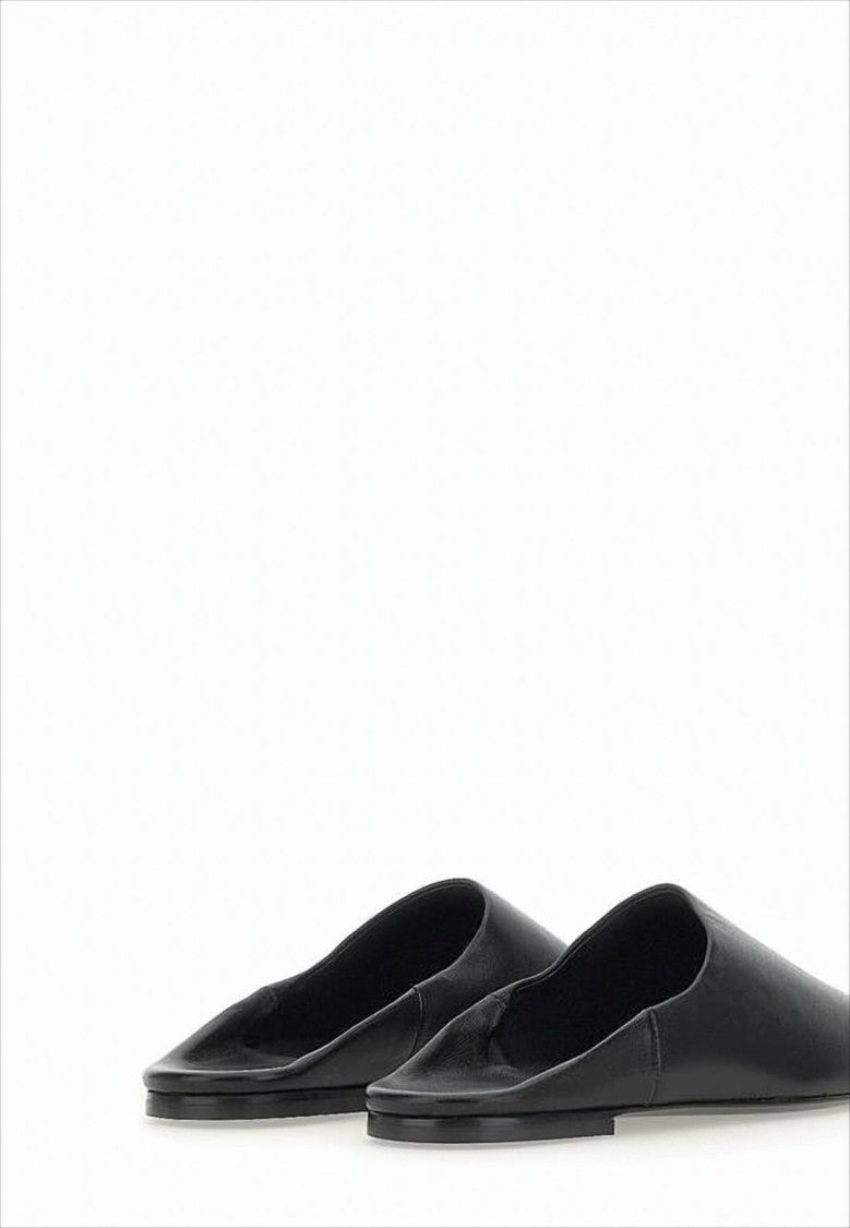 Courrèges Minimalist Black Lambskin Slip-On Mules With Embossed Detail