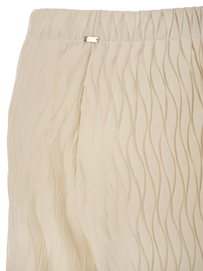 Herno Trousers With Crumpled Effect And Wavy Pattern