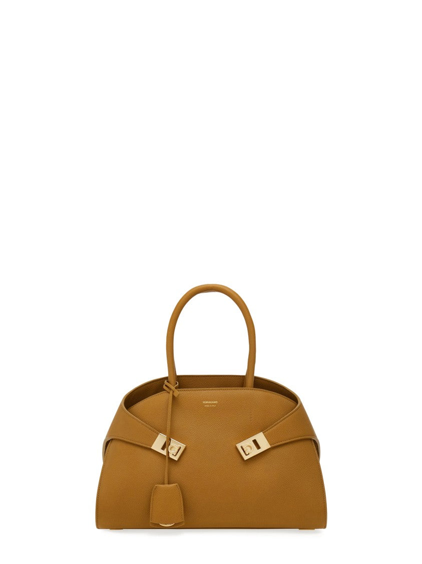 Ferragamo Curved Silhouette Structured Handbag With Gold Accents