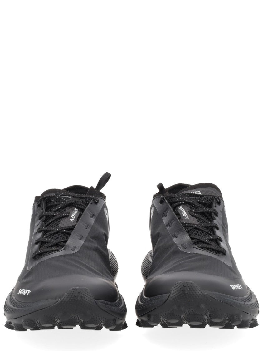 Satisfy Streamlined Black Sneakers With Rugged Tread And Textural Details