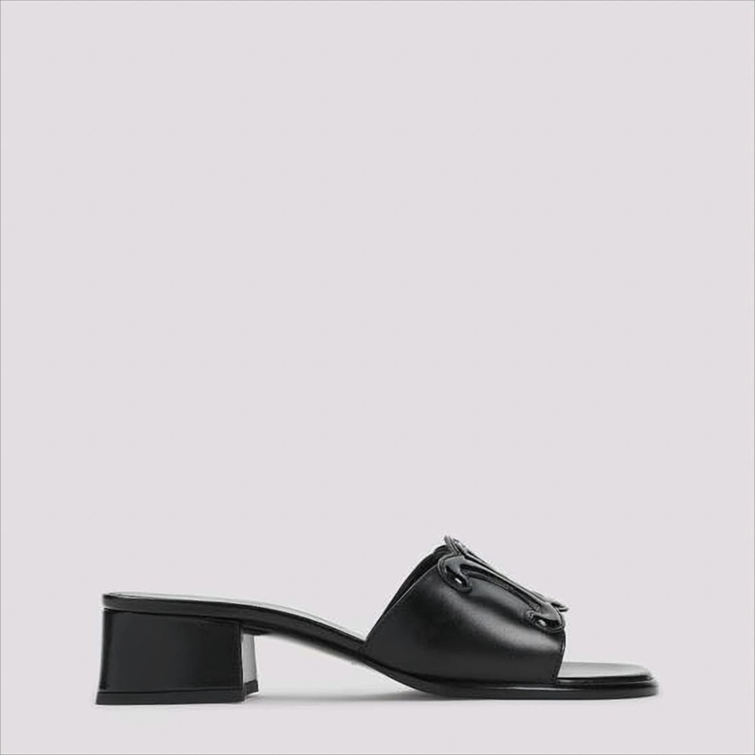 Celine Open Toe Mules With Glossy Emblem Detail