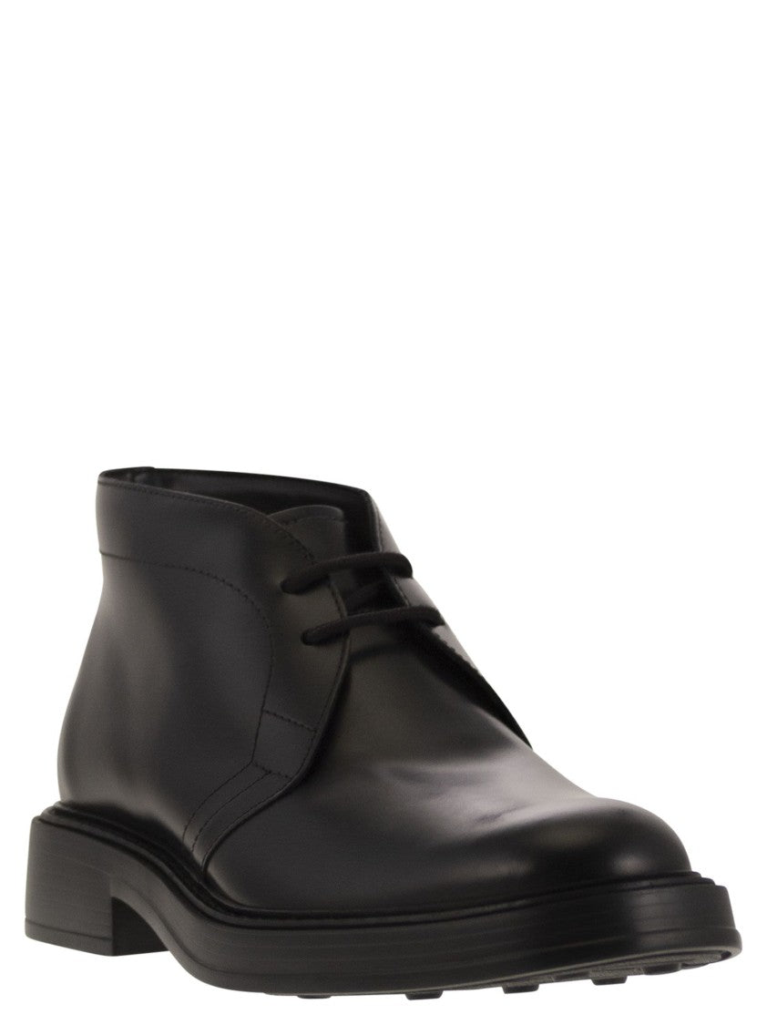 Tod's Calfskin Ankle Boots With Embossed Monogram