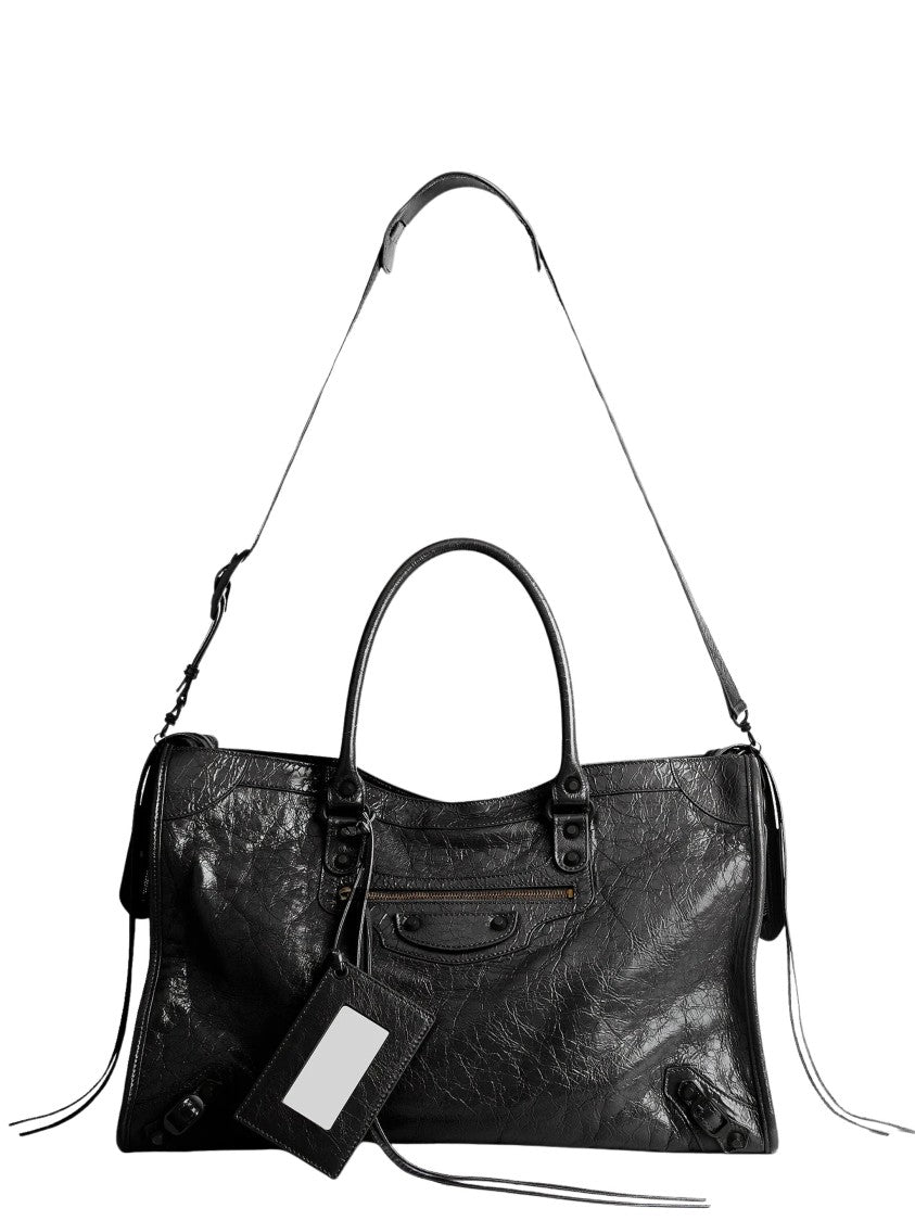 Balenciaga Textured Leather Travel Bag With Removable Charm And Adjustable Strap