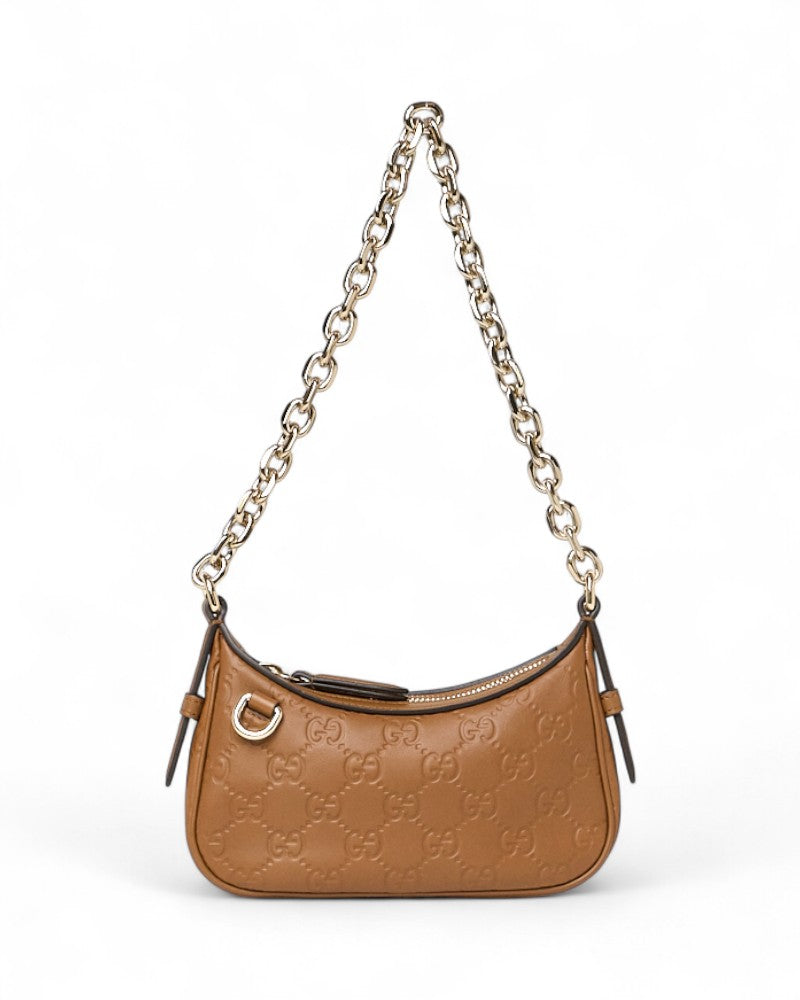 Gucci Mini Pochette In Gg Guccissima Embossed Leather With Gold Chain Handle