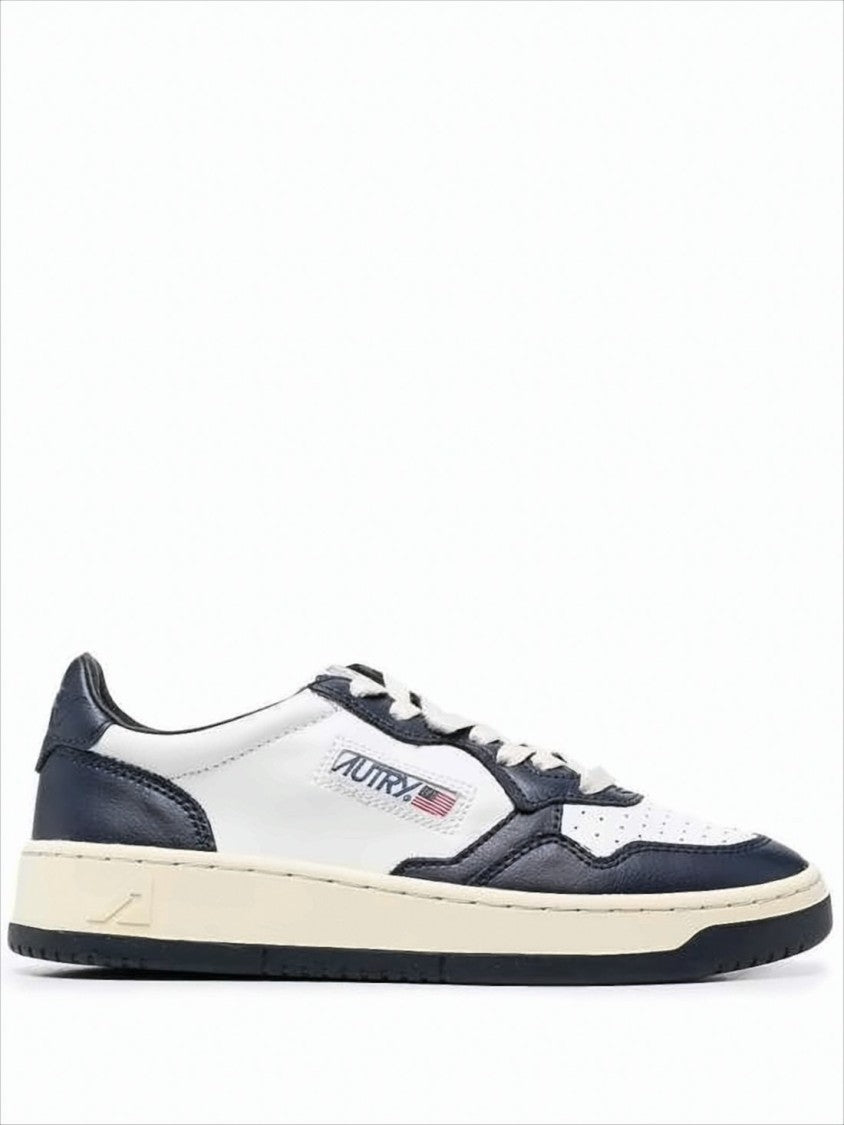 Autry Low-Top Leather Sneakers With Navy Overlays And Perforated Details