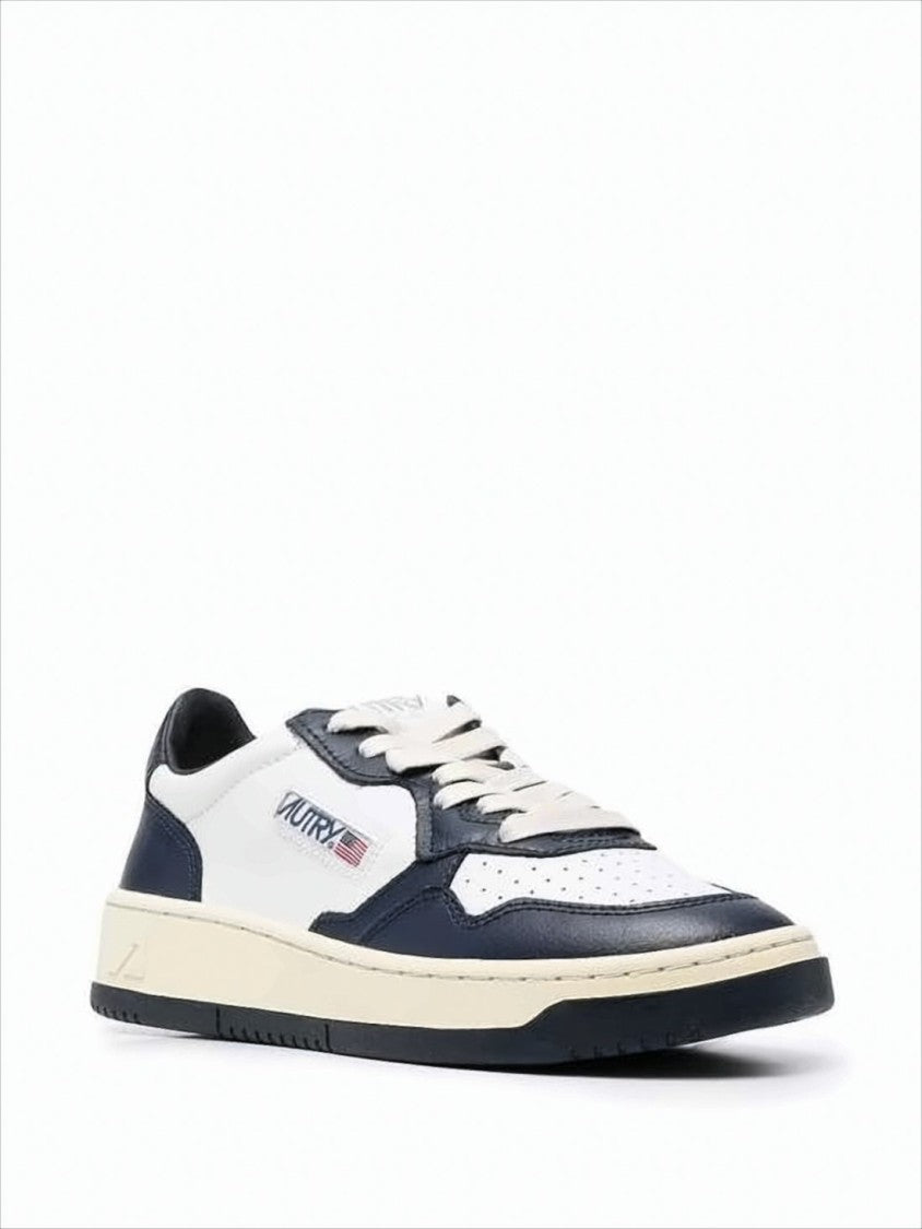 Autry Low-Top Leather Sneakers With Navy Overlays And Perforated Details