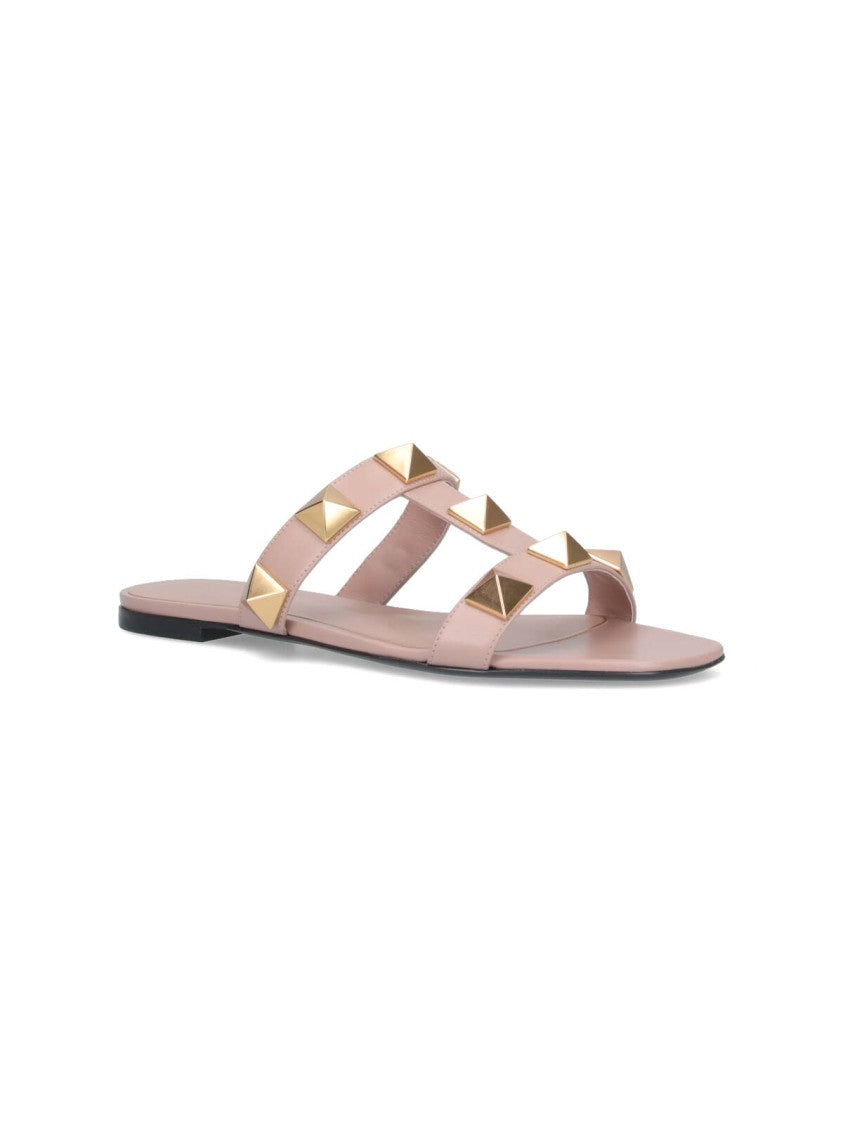 Valentino Garavani Minimalist Pink Flat Sandals With Pyramid Gold Studs