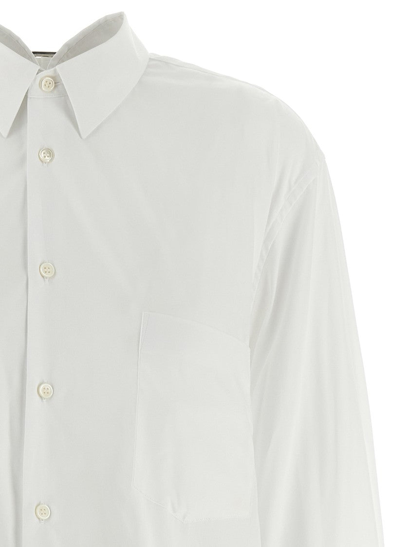 Comme Des Garçons Asymmetric Hem Shirt With Front Button Closure And Unique Silhouette