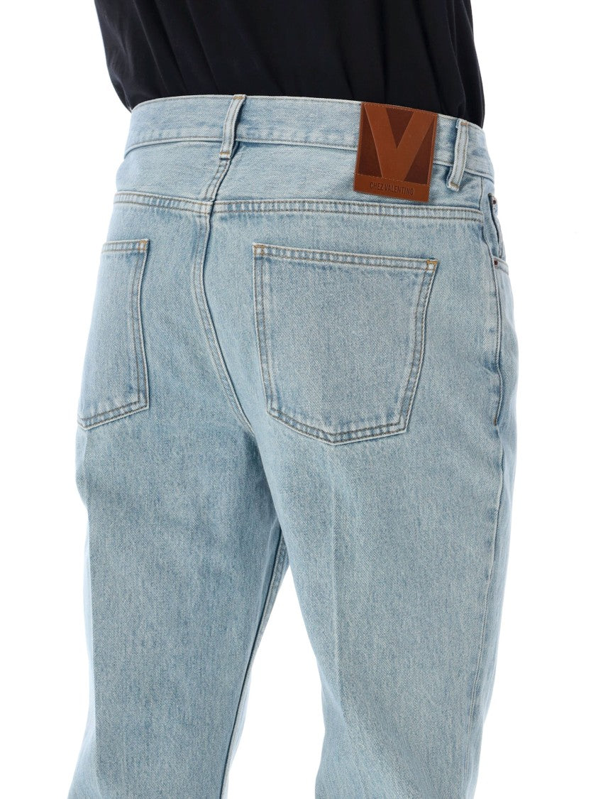 Valentino Garavani Light-Wash Flared Jeans With Iconic Branding Details