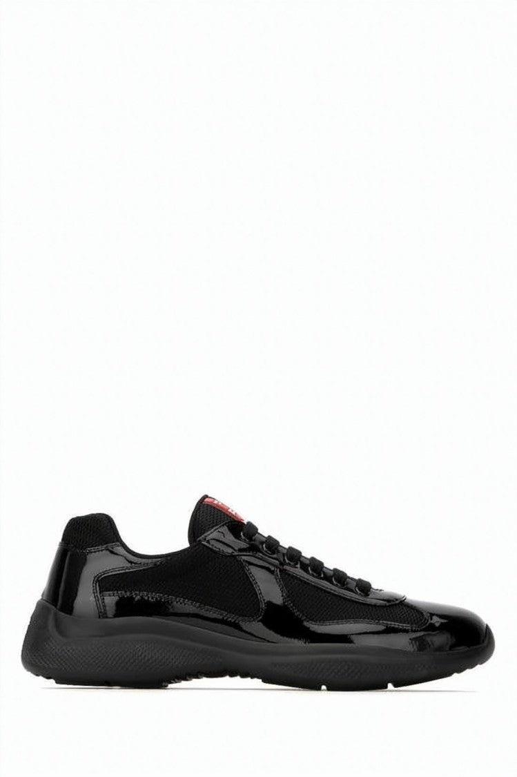 Prada Glossy Black Low-Profile Sneakers With Red Logo Detail