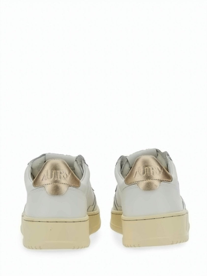 Autry Low-Top Leather Sneakers With Perforated Detailing And Metallic Accents