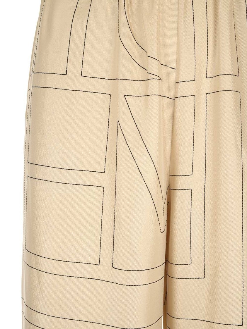 Totême Cropped Silk Pajama Bottoms With Subtle Monogram Pattern