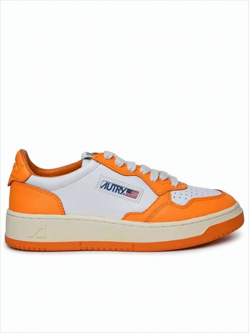 Autry Low-Top Sneakers With Vibrant Orange Overlays And Perforated Detailing