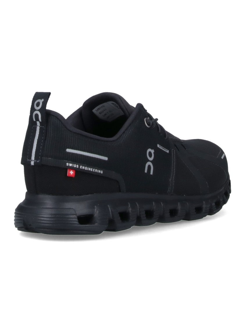 On Low-Profile Sneakers With Segmented Sole And Reflective Accents