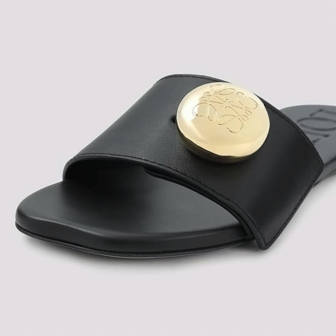 Loewe Minimalist Black Slide Sandals With Gold-Tone Medallion