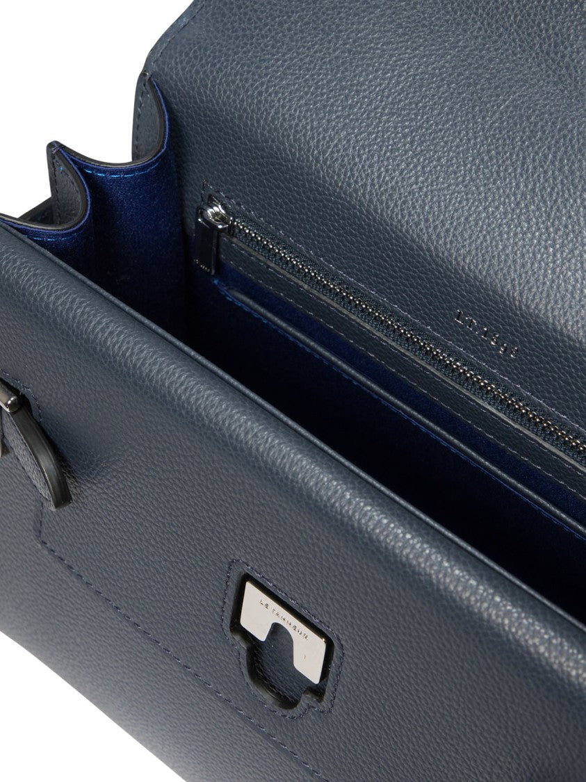 Le Tanneur Compact Structured Handbag With Triangular Flap Closure