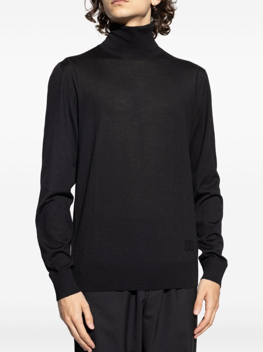 Dolce & Gabbana Fitted Black Turtleneck Sweater With Embossed Detail