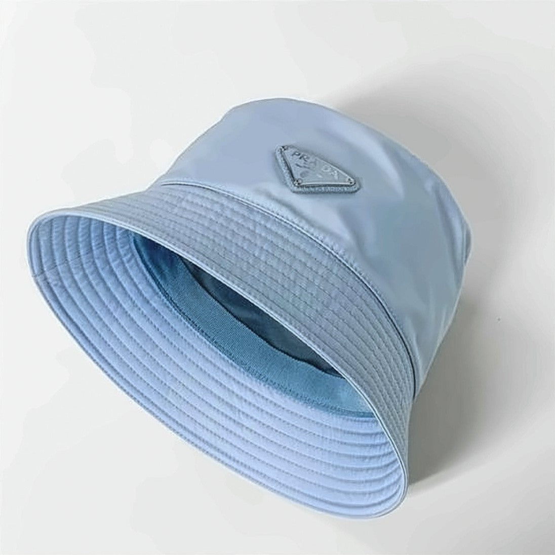 Prada Nylon Bucket Hat With Triangular Logo Plaque