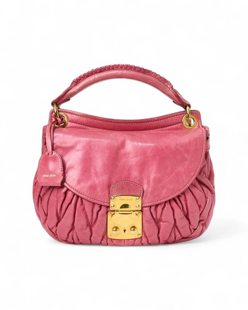 Miu Miu Small Embossed Coffer In Fuchsia