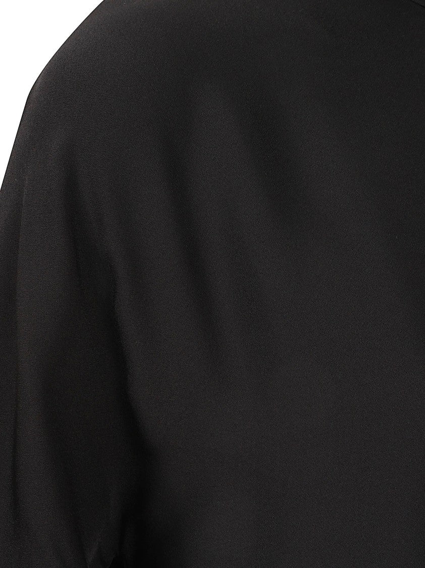 Alaïa Asymmetrical Hem Mini Dress With High Neckline