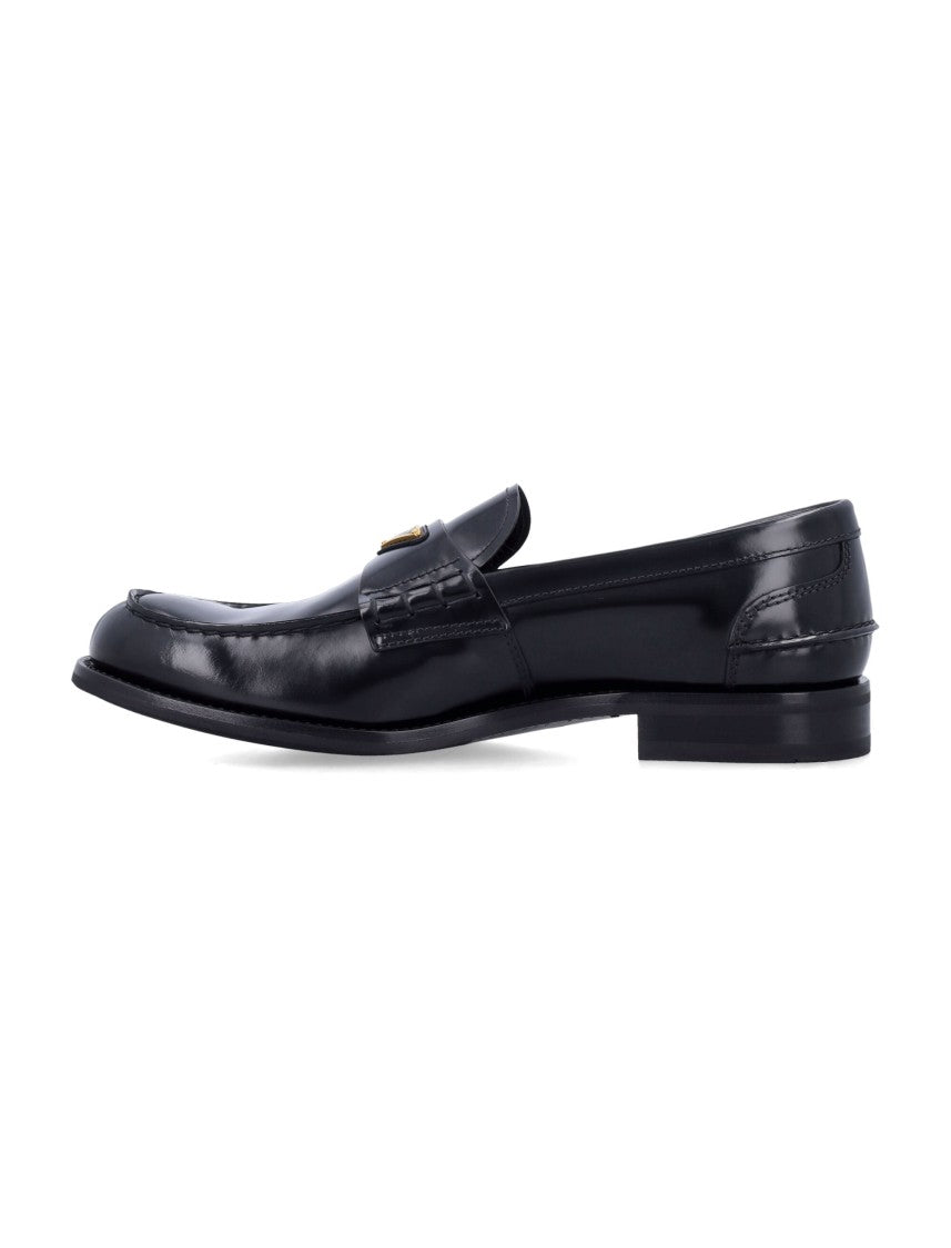 Prada Brushed Leather Loafers With Enameled Metal Logo