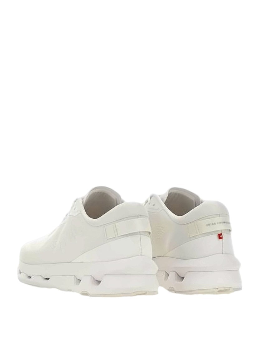 On Running Minimalist White Sneakers With Rubber Segmented Sole
