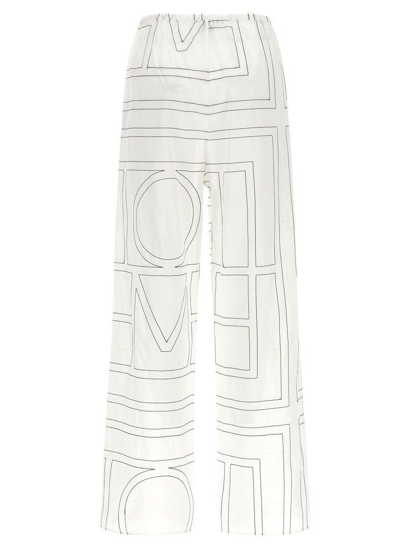 Totême Wide Leg Pajama-Style Pants With Monogram Embroidery