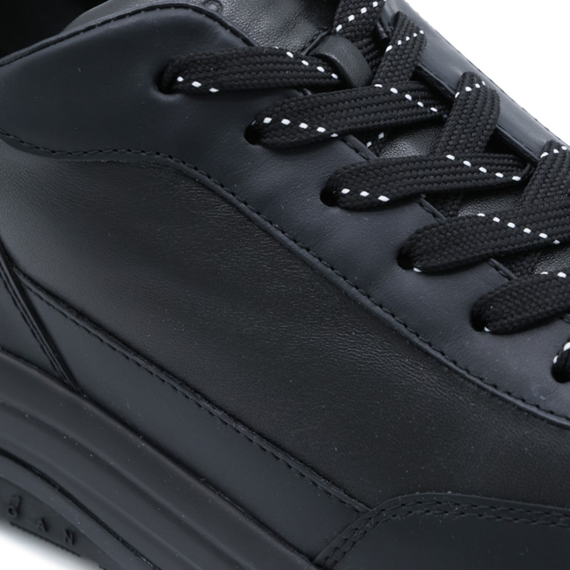 Hogan Minimalist Black Sneakers With Reflective Accents And Contoured Sole