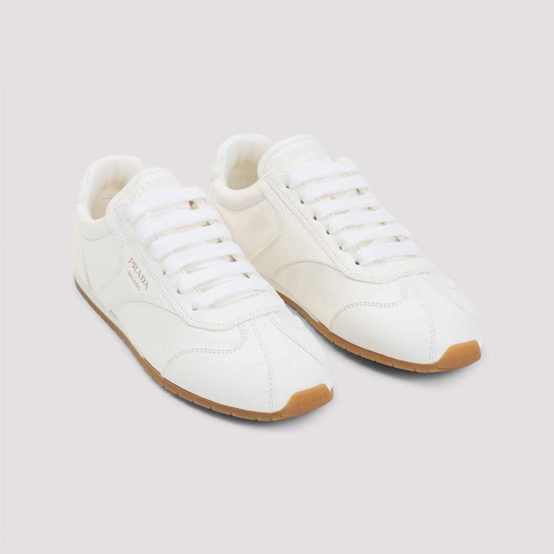 Prada Minimalist White Leather Sneakers With Contrasting Sole